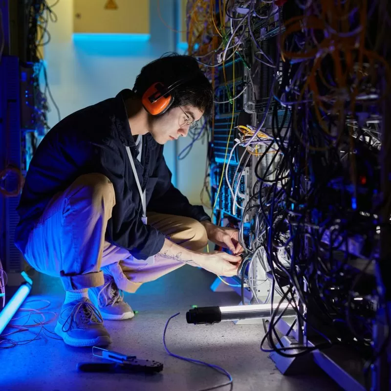 Asian Man Working with Network Server