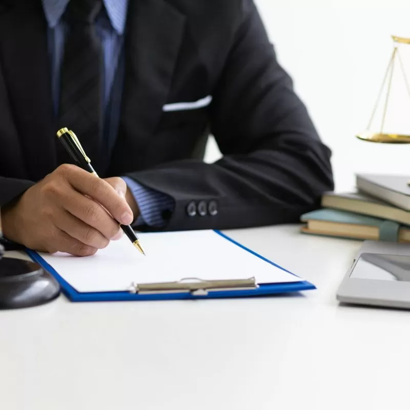 Attorney working on a desk in a law firm.