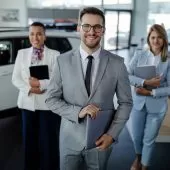 salesteam-in-dealership-three-beautiful-consultants-or-managers-in-elegant-suit-looking-on-camera-.jpg